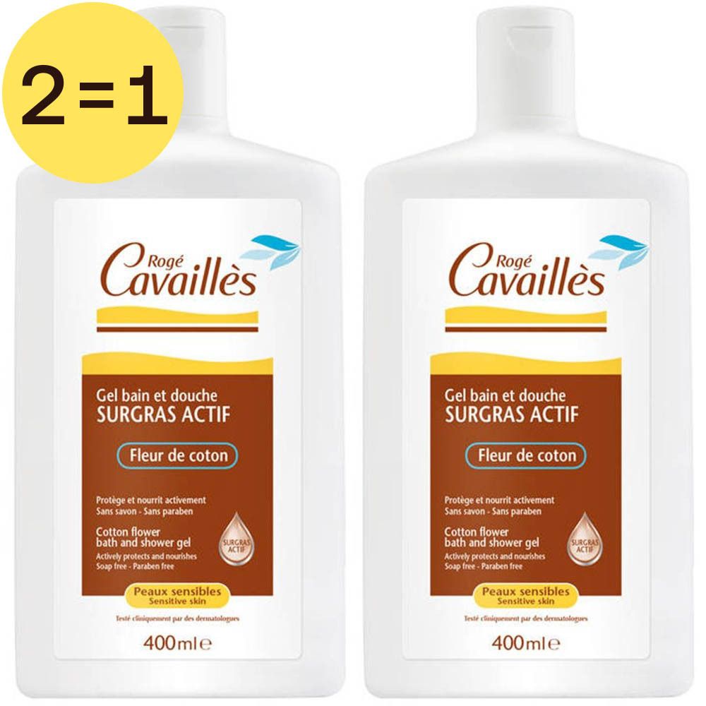 Deux flacons blancs de gel douche Rogé Cavaillès. Inscription : Gel bain et douche SURGRAS ACTIF Fleur de coton. Autocollant 2=1.