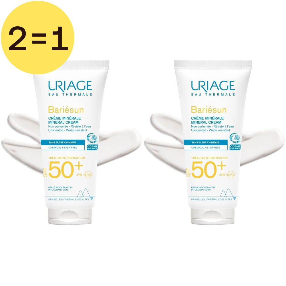 Deux tubes de crème minérale Uriage Bariesun SPF50+ avec "2=1". Traces de crème blanche. Cercle jaune avec "2=1".