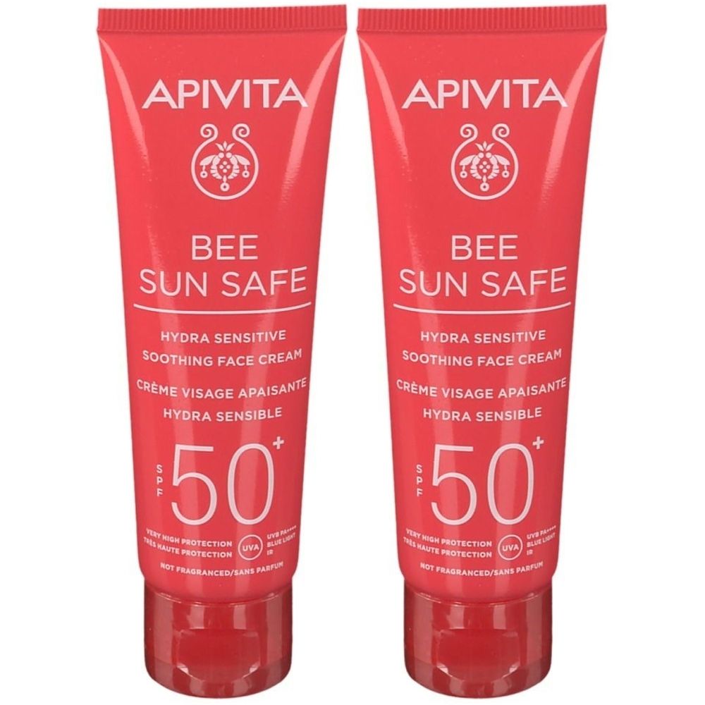 Zwei Tuben Apivita Bee Sun Safe Gesichtscreme SPF50+. Rote Verpackung, weißer Text. Marke und Produktbezeichnung deutlich sichtbar.
