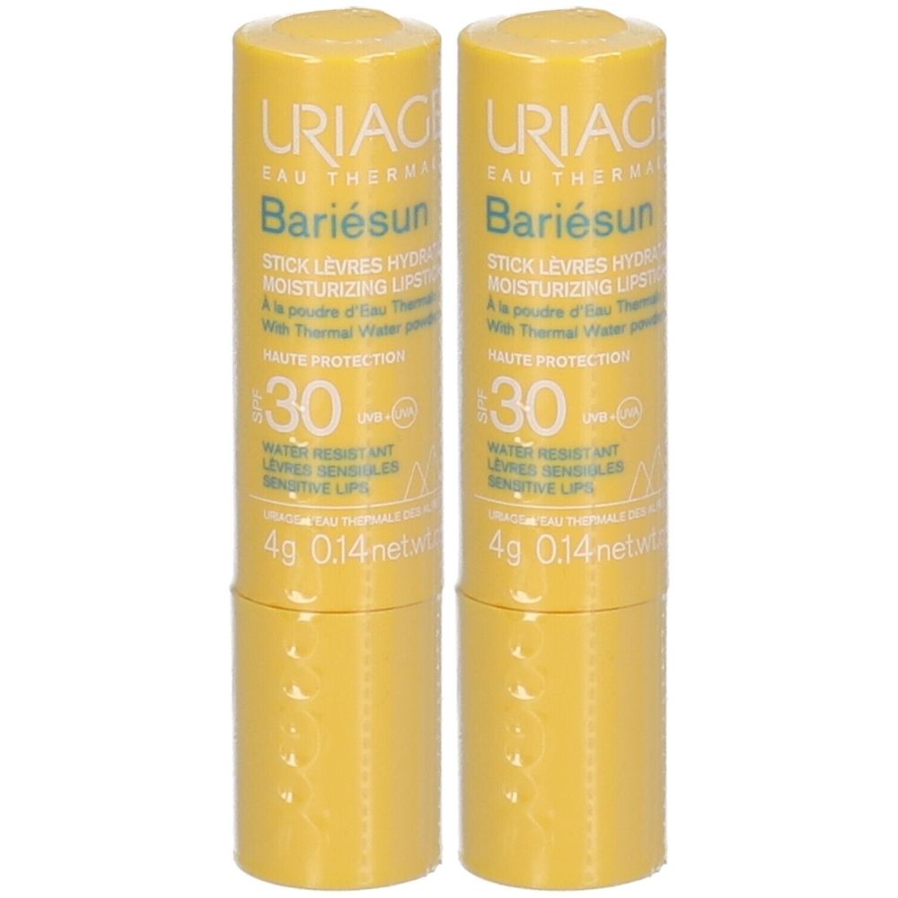 Deux sticks à lèvres jaunes. Inscription: Uriage Bariésun, SPF 30. Résistant à l'eau pour lèvres sensibles.
