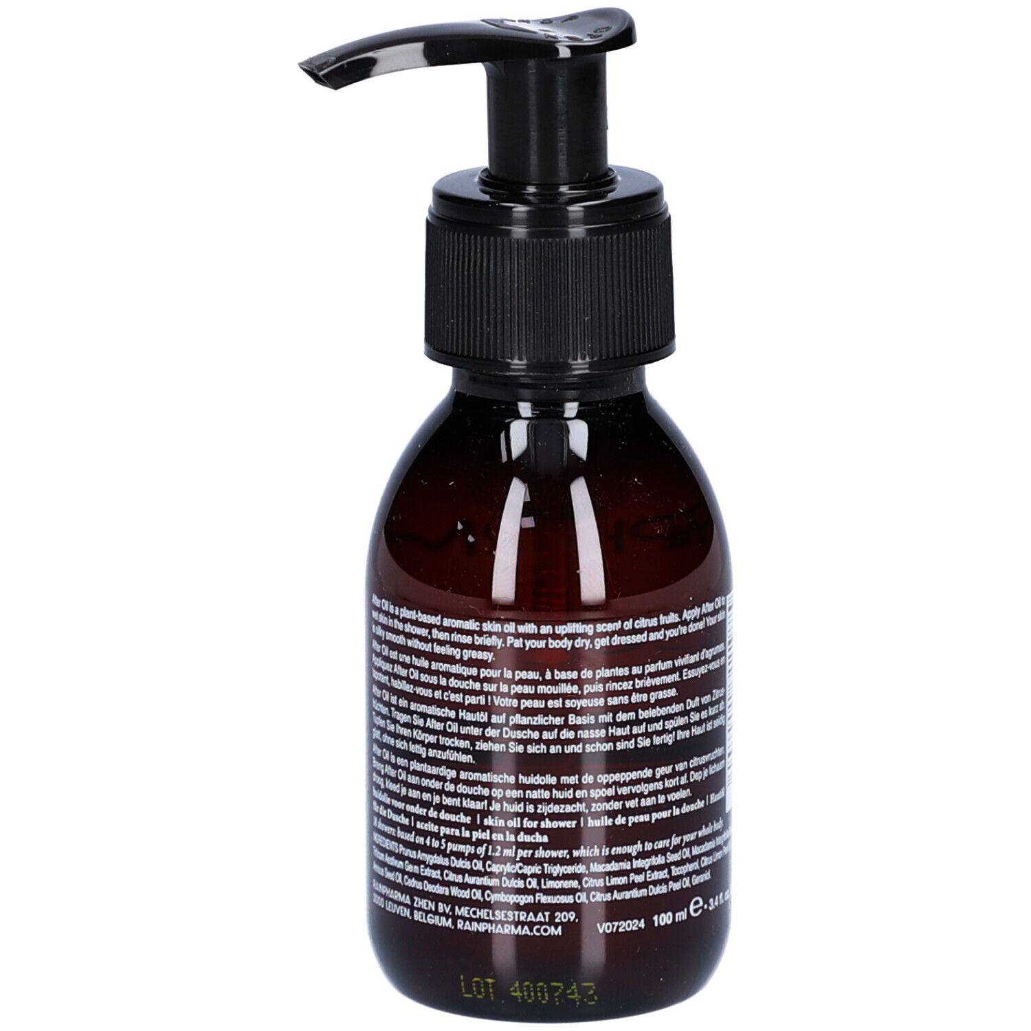 Braune Flasche mit schwarzem Pumpverschluss. Etikett mit Text. Rückansicht.