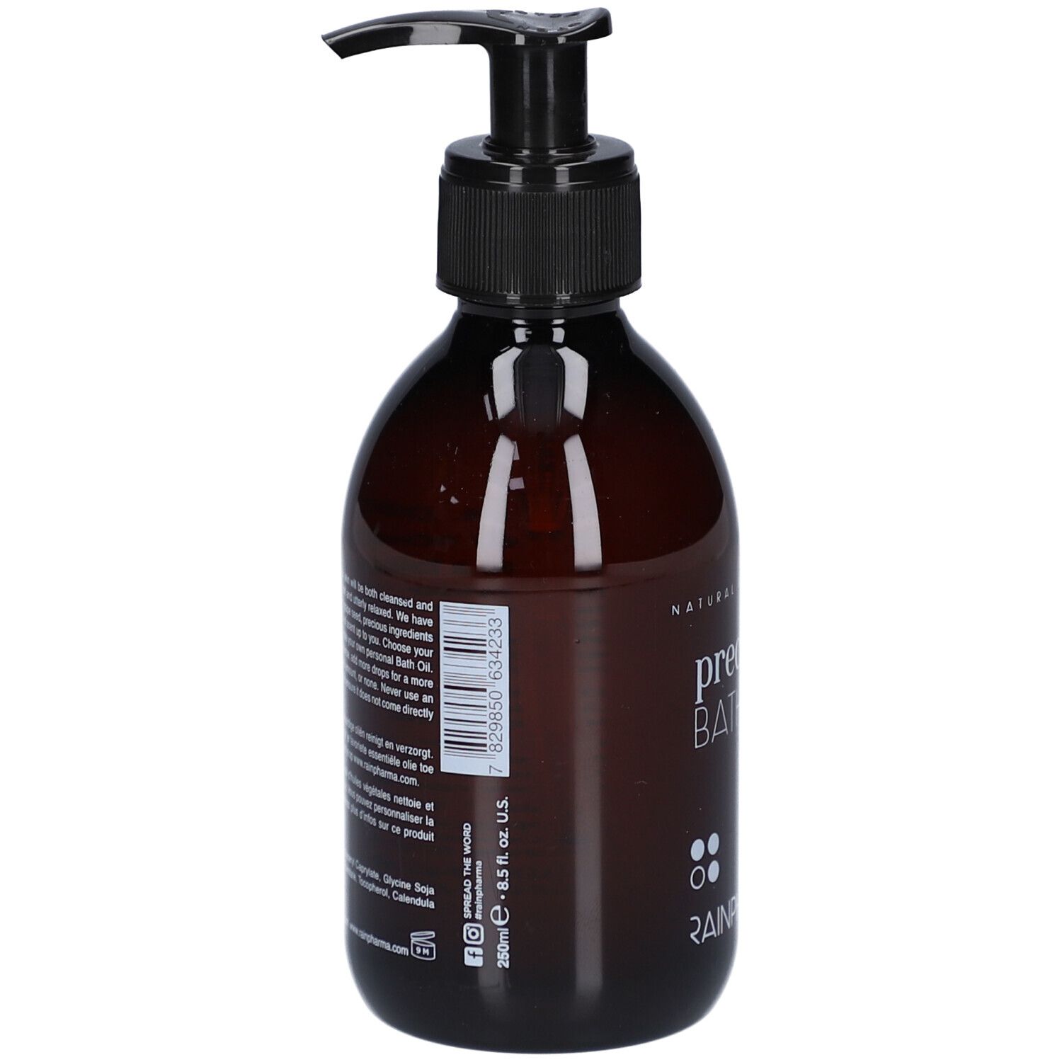 Braune Flasche mit schwarzem Pumpverschluss. Aufschrift: precious BATH OIL. Rückseite mit Text und Barcode.