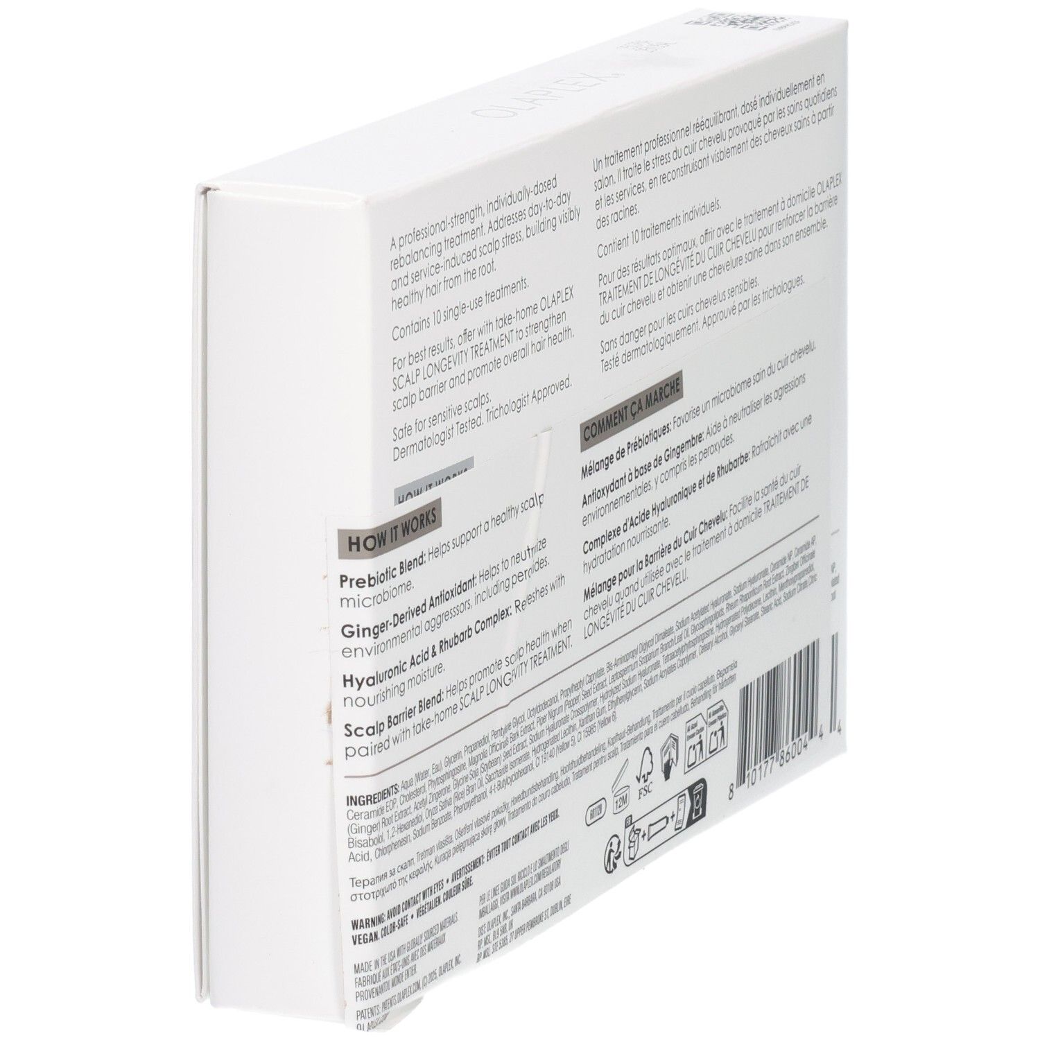 Weiße Verpackung für Haar- und Kopfhautbehandlung mit Text und Symbolen.