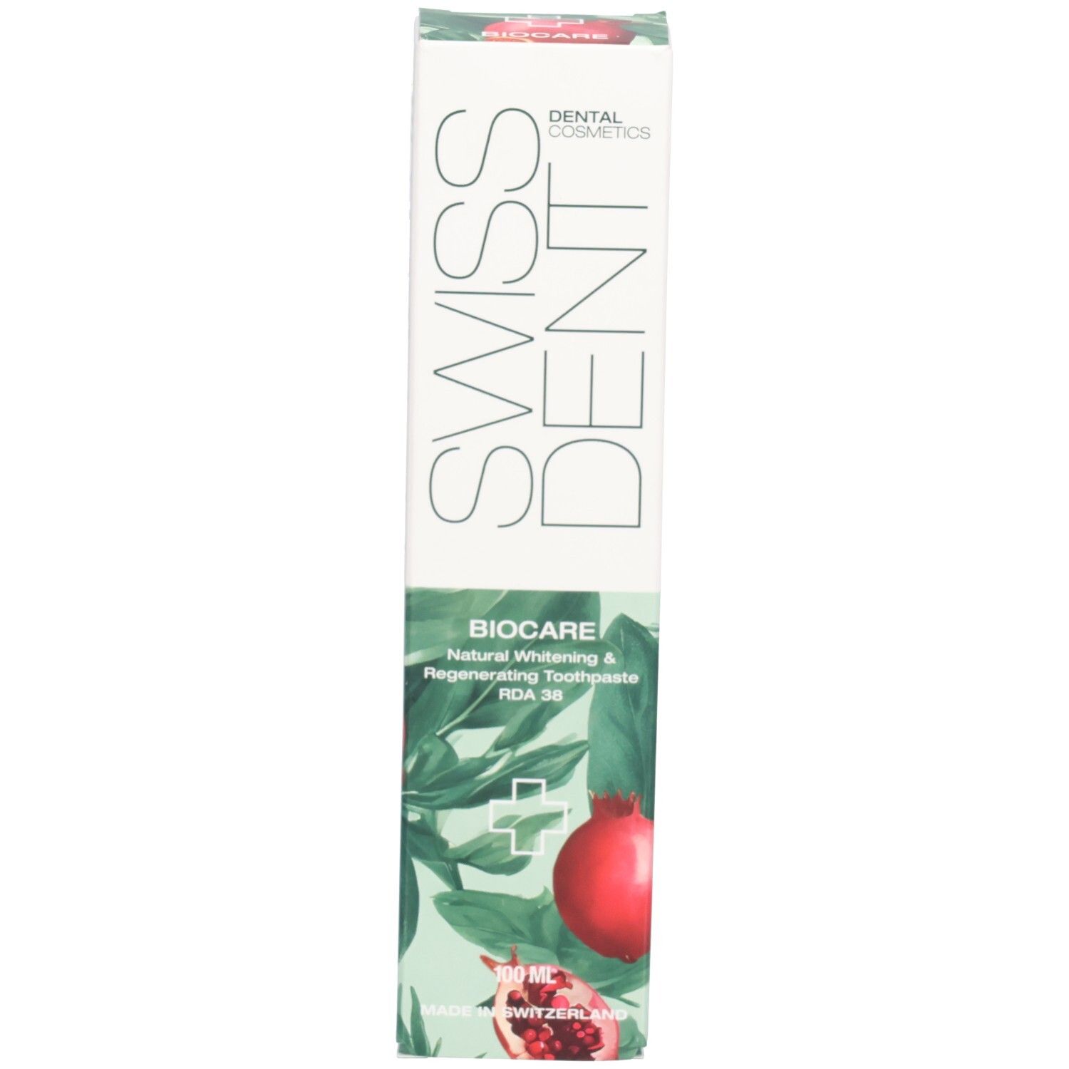 Schachtel mit Zahnpasta. Aufschrift: SWISSDENT, BIOCARE. Granatapfel-Illustration. Text: Natural Whitening & Regenerating Toothpaste.