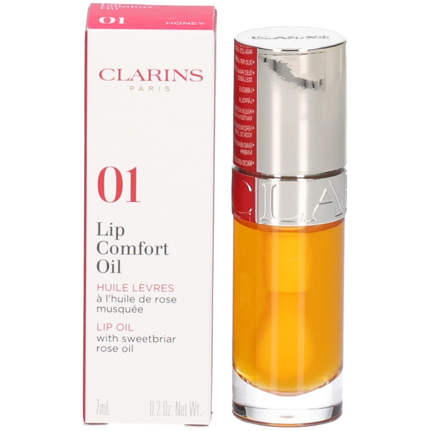 Clarins Lip Comfort Oil 01 Honey in Glasflasche mit silbernem Applikator. Kartonverpackung daneben.