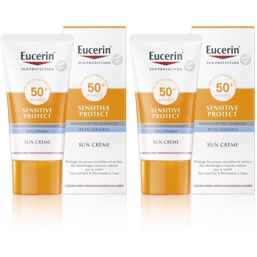 Zwei Tuben und zwei Kartons Eucerin Sun Creme SPF 50+. Weiße Tuben mit orangefarbenen und blauen Akzenten. Aufschrift: Sensitive Protect.