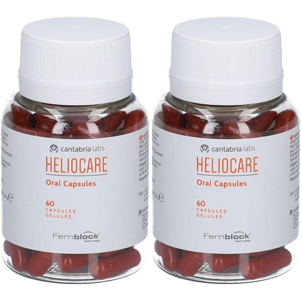 Deux flacons de Heliocare Oral Capsules. Flacons transparents avec bouchons blancs et étiquettes. Gélules rouges visibles.