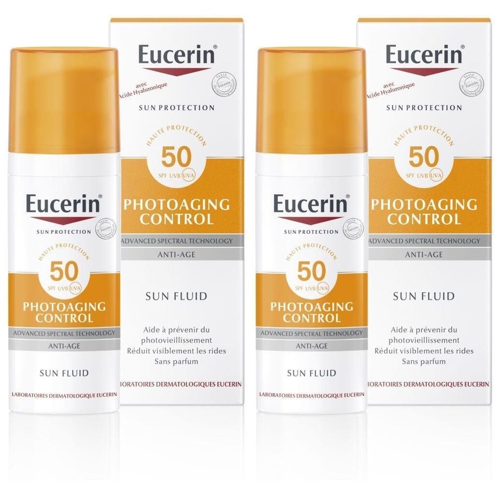 Mehrere Flaschen und Verpackungen von Eucerin Photoaging Control Sun Fluid SPF 50. Weiße Flaschen mit orangefarbenen Kappen und Verpackungen.