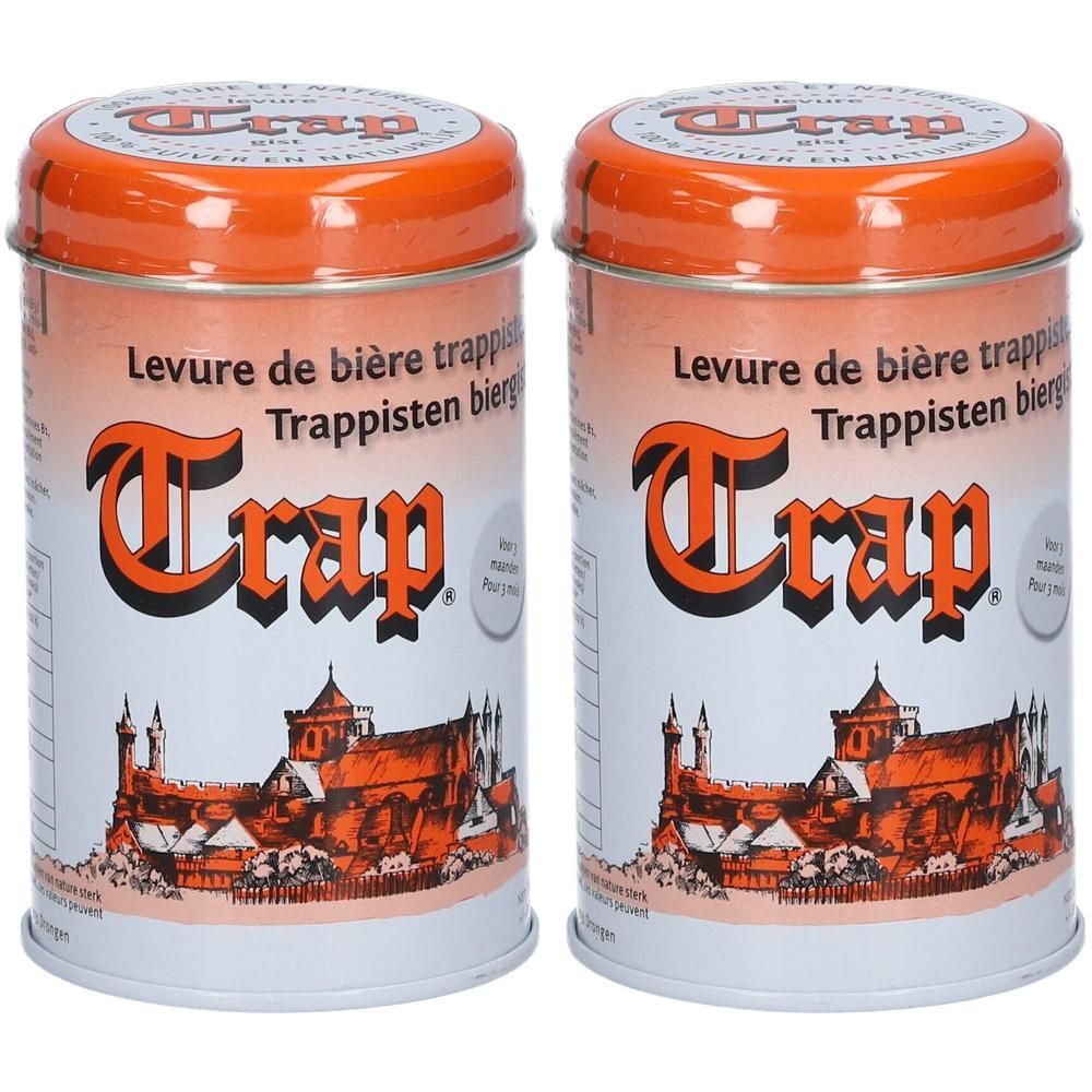 Zwei zylindrische Dosen mit orangefarbenen Deckeln. Aufschrift "Trap" und "Levure de bière trappisten bierhefe".