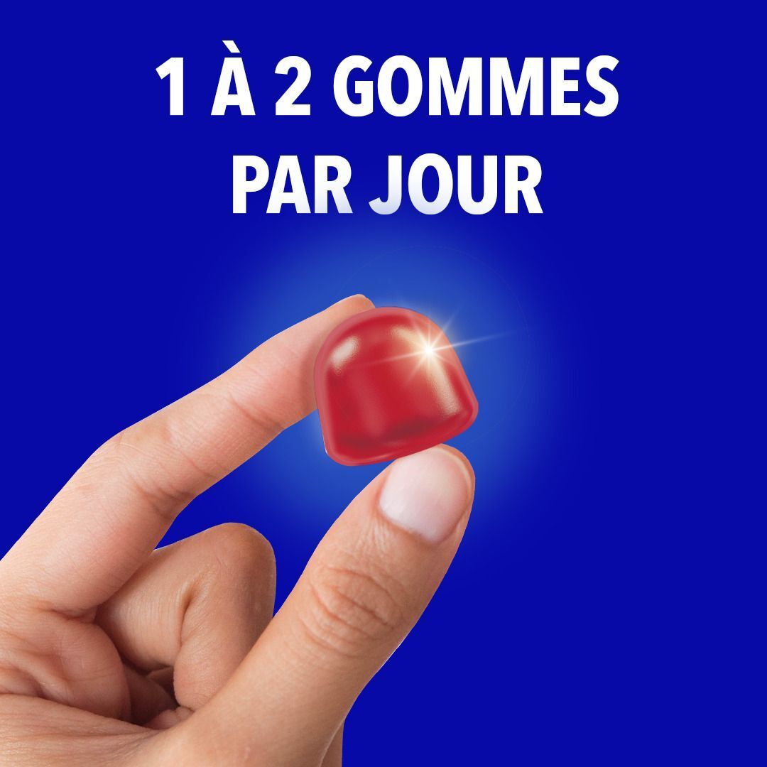 Gomme rouge avec points blancs. Texte: FORMULE 3 EN 1, VITAMINE B3 ET C, ZINC, BACTÉRIES.