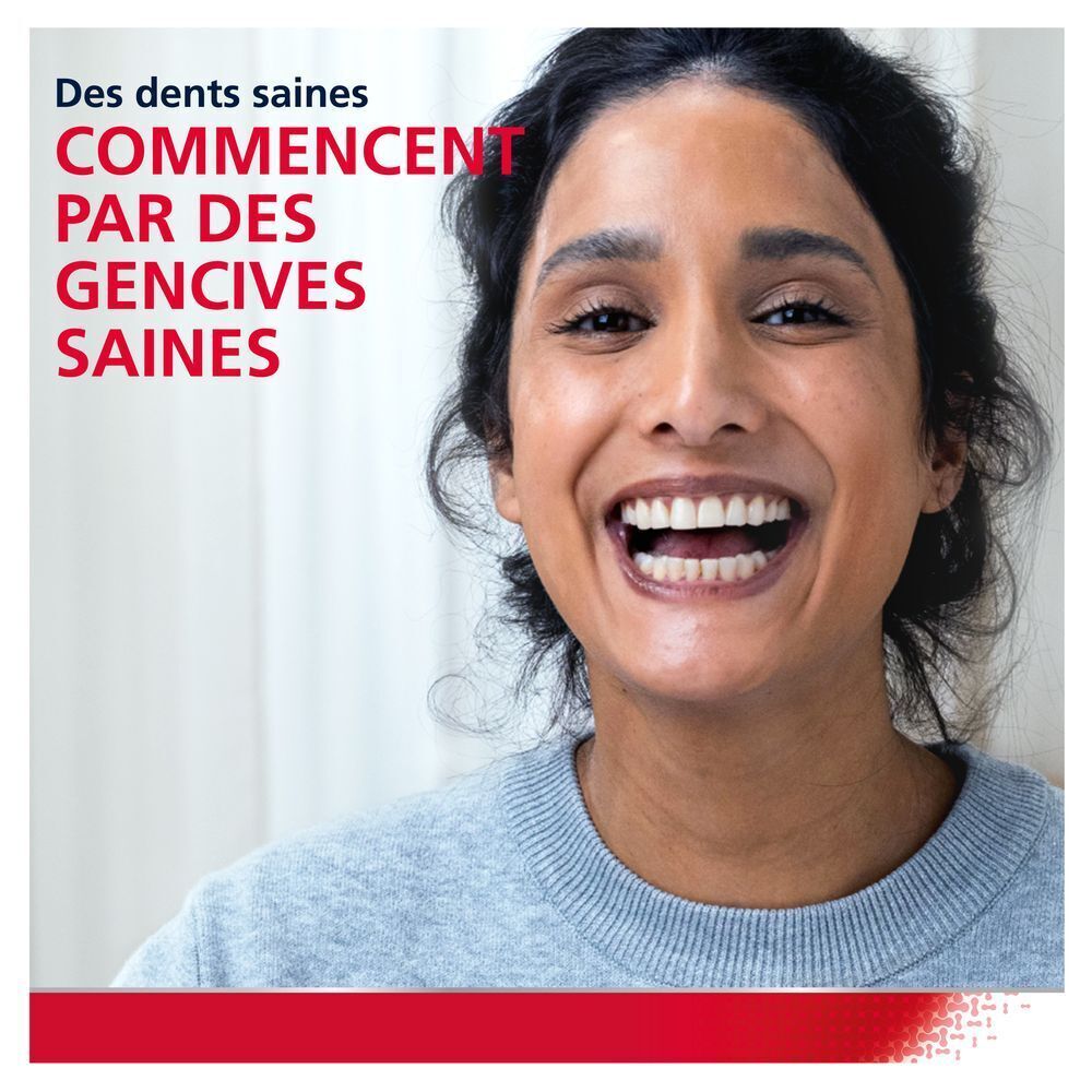 Femme souriante. Texte : Des dents saines commencent par des gencives saines.