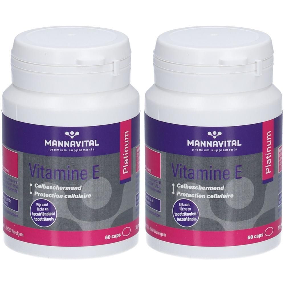 Zwei Flaschen MannaVital Vitamin E Platinum. Weiße Flaschen mit lila und pinkfarbenen Etiketten. Aufschrift: Vitamine E, 60 caps.