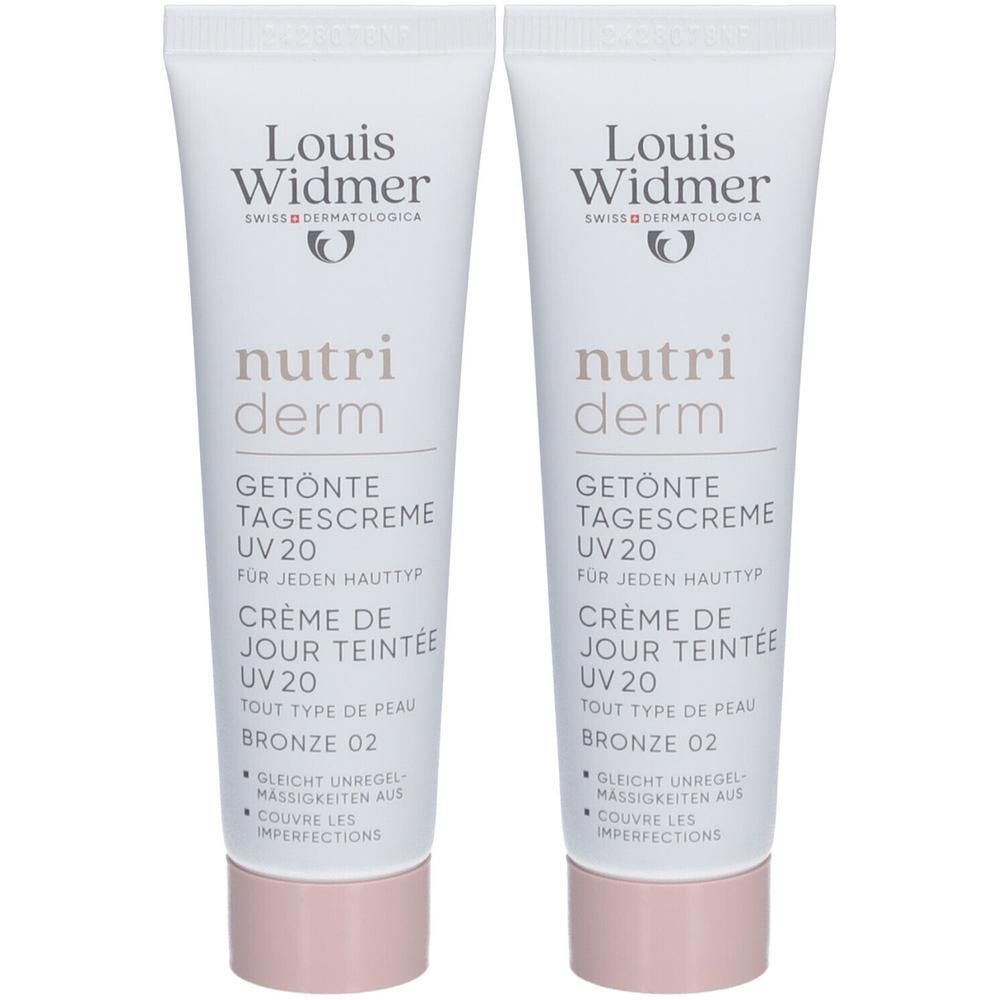 Deux tubes de crème de jour teintée Louis Widmer Nutriderm UV20 Bronze 02. Tubes blancs, texte et bouchon rose.