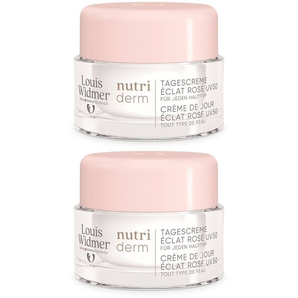 Deux pots de crème de jour Louis Widmer Nutriderm avec couvercles roses. Inscription: Eclat Rose UV50.
