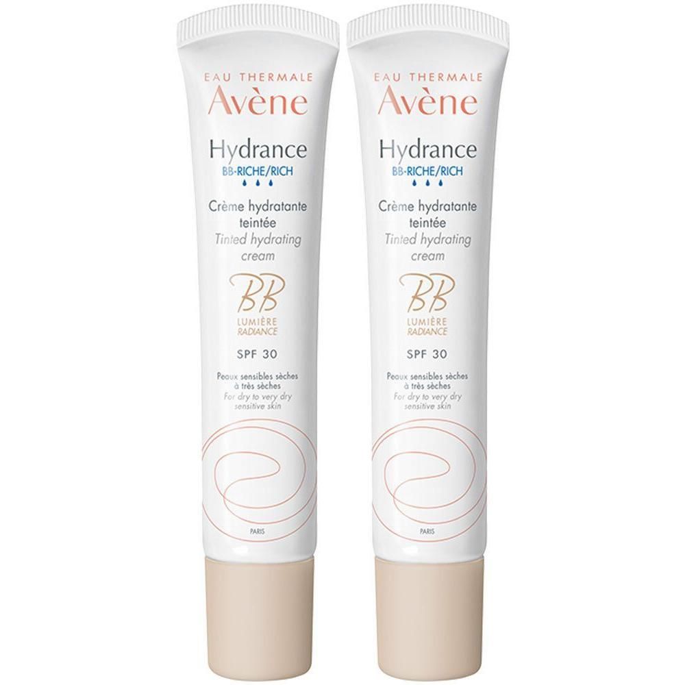 Zwei Tuben getönte Feuchtigkeitscreme. Weiß, mit Aufschrift 'Avène Hydrance BB'. Mit Lichtschutzfaktor 30. Für trockene, empfindliche Haut.