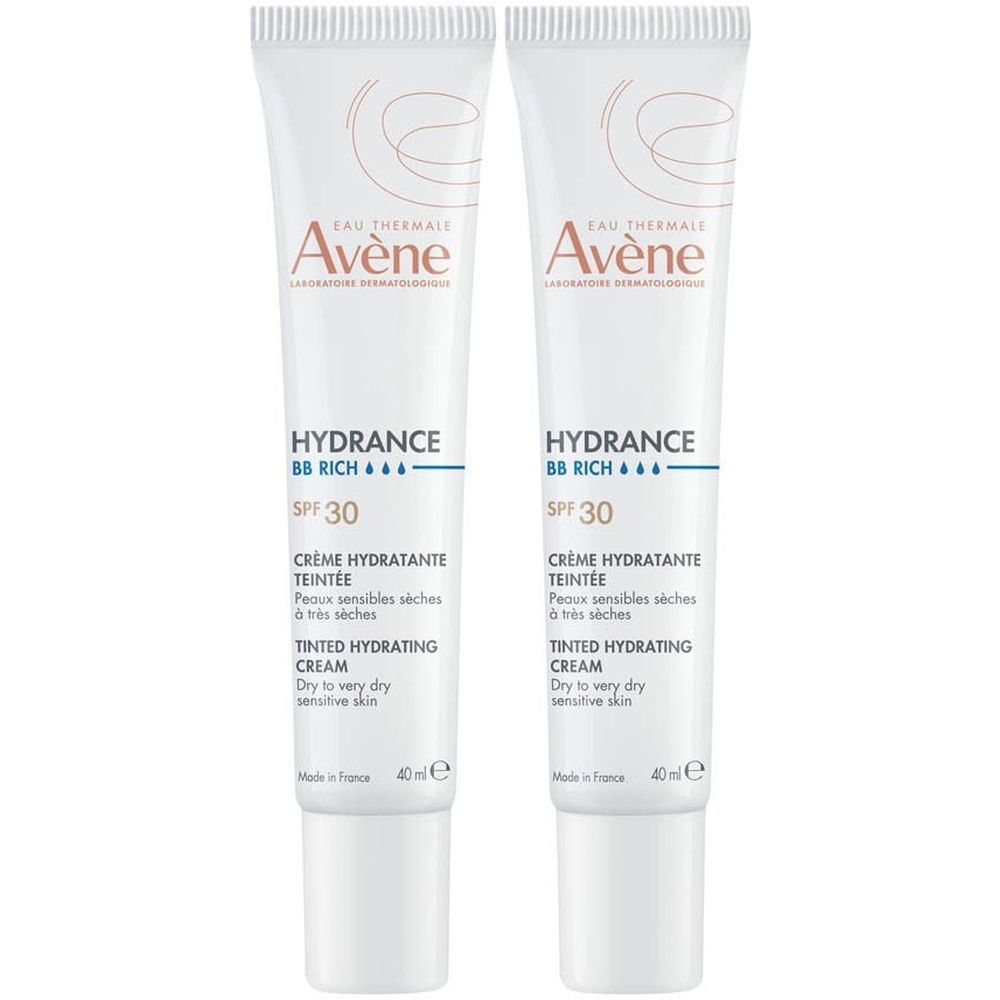 Deux tubes de crème hydratante teintée. Blancs, avec inscription 'Avène Hydrance BB'. Avec protection solaire SPF 30. Pour peaux sèches et sensibles.