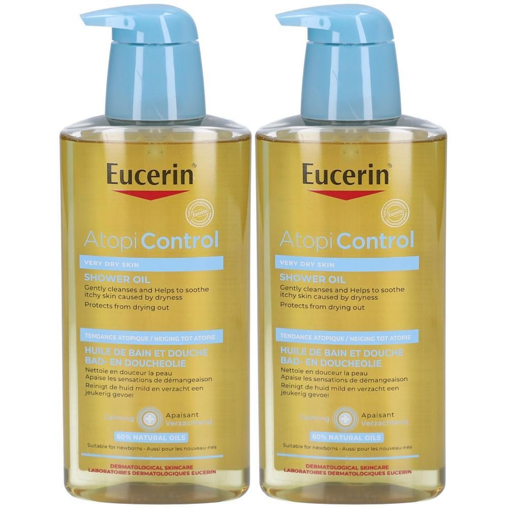 Zwei Flaschen Eucerin AtopiControl Dusch- und Badeöl. Hellgelbe Flüssigkeit in transparenten Flaschen mit blauem Pumpkopf. Produktname und Logo sichtbar.