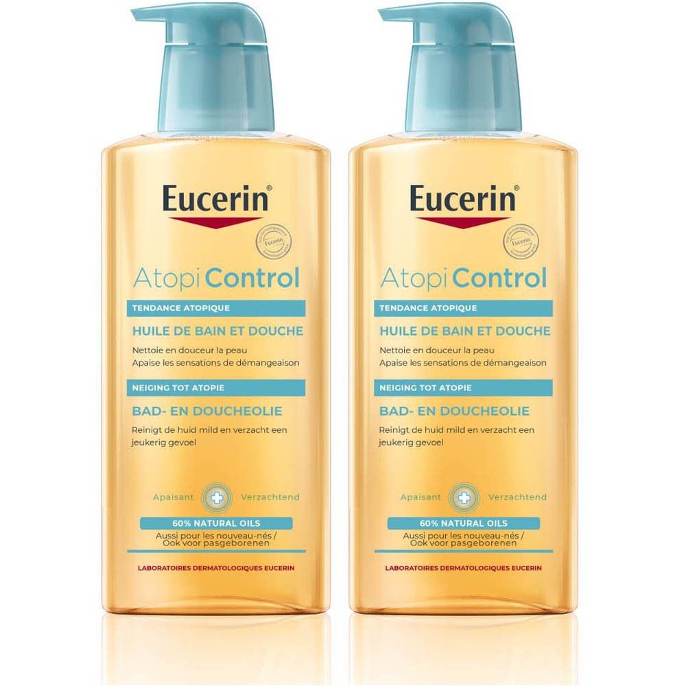 Deux flacons d'huile de douche et de bain Eucerin AtopiControl. Liquide jaune clair dans des flacons transparents avec pompe bleue. Nom et logo du produit visibles.