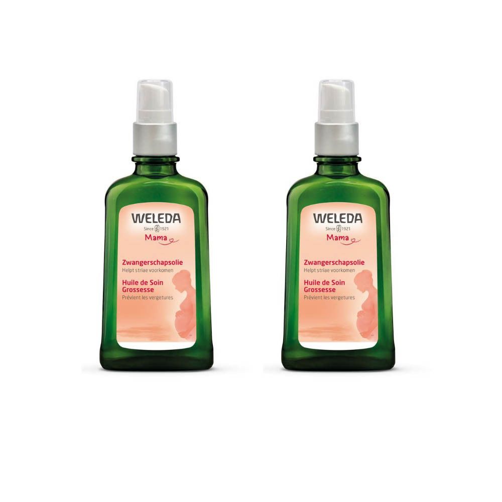 Deux flacons verts avec vaporisateur. L'étiquette indique "Weleda Mama Huile de Soin Grossesse".