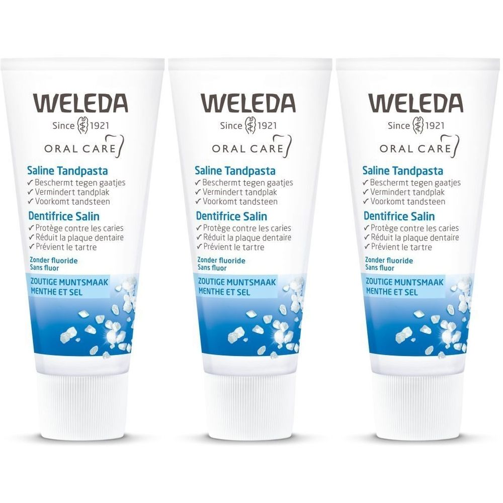 Trois tubes de dentifrice Weleda Saline. Tubes blancs avec texte bleu et vert. Texte: Saline Tandpasta, Zoutige Muntsmaak, Menthe et Sel.