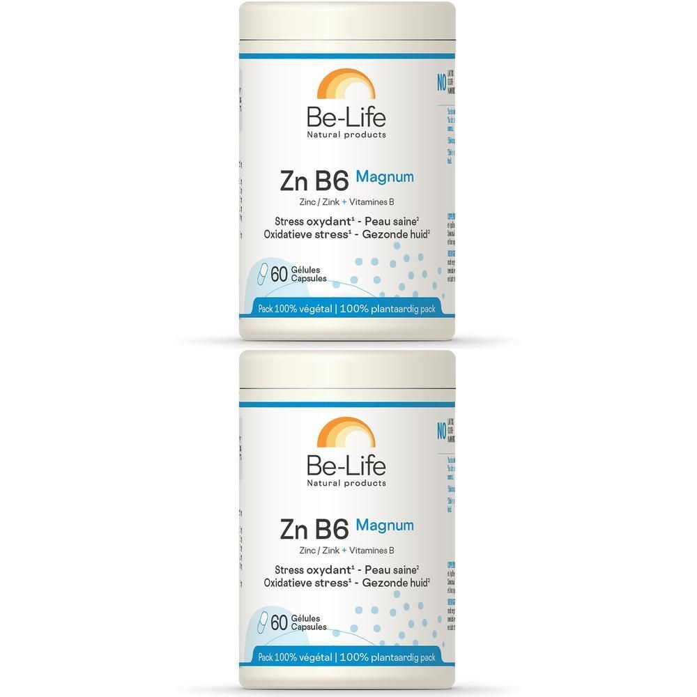Zwei weiße Dosen mit Etiketten. Aufschrift: Be-Life Zn B6 Magnum, 60 Kapseln. Oben Logo mit Sonne.