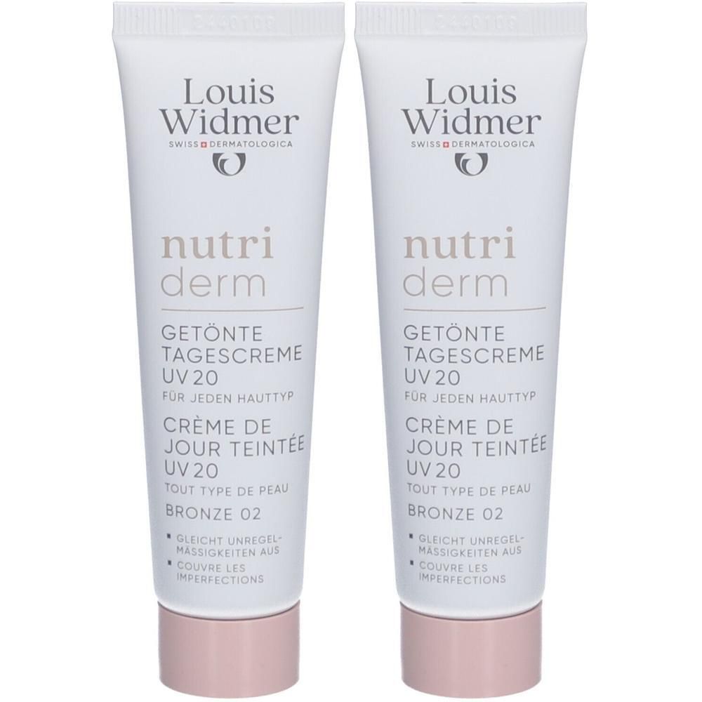 Zwei Tuben Louis Widmer Nutriderm Tagescreme UV20 Bronze 02. Weiße Tuben mit Schriftzug und Logo. Rosa Verschlusskappe.