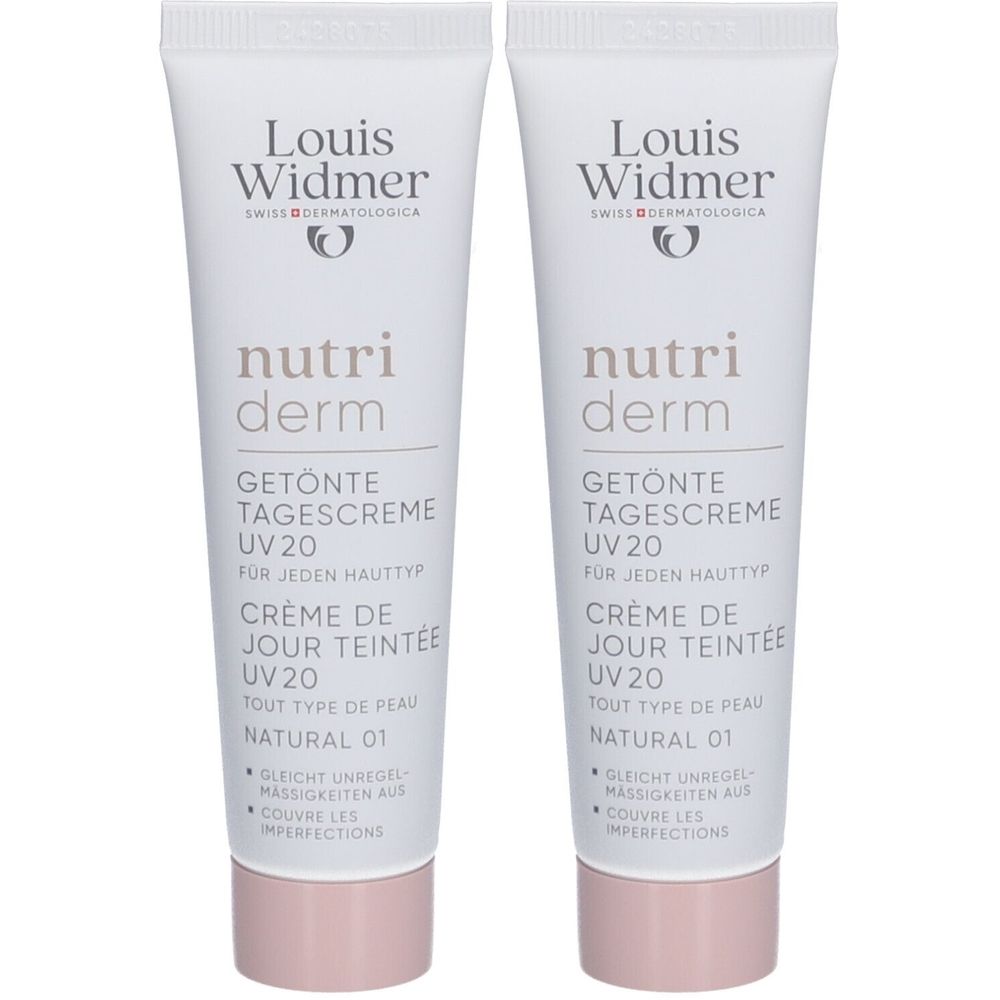 Zwei Tuben Louis Widmer Nutriderm Tagescreme UV20 Natural 01. Weiße Tuben mit Schriftzug und rosa Verschlusskappe.
