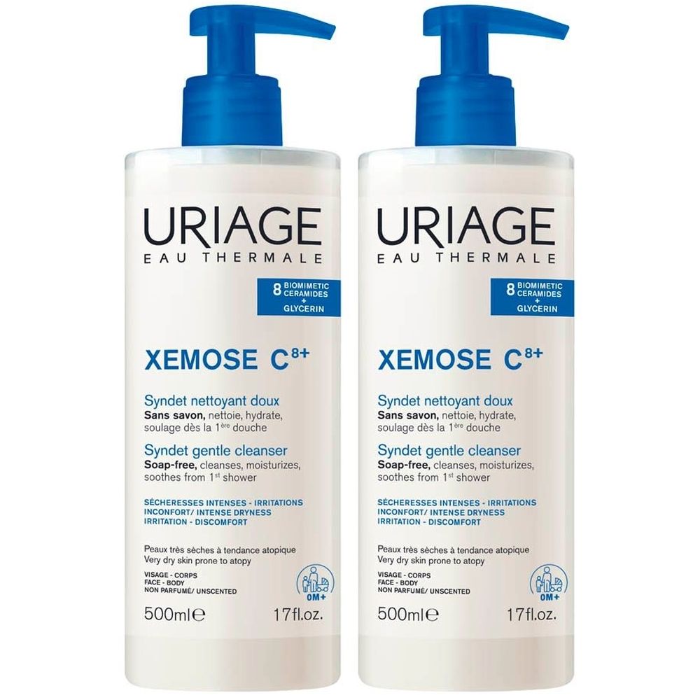 Deux flacons Uriage Xemose C+ Syndet. Flacons blancs avec pompe bleue. Texte: Syndet gentle cleanser, 500ml.