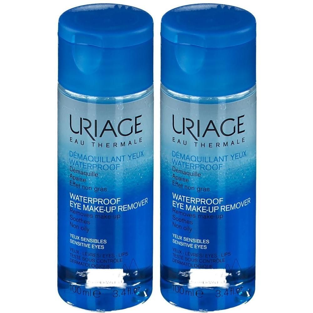 Zwei Flaschen Uriage Augen-Make-up-Entferner. Blaue Kappen und Etiketten. Text: Waterproof Eye Make-up Remover.