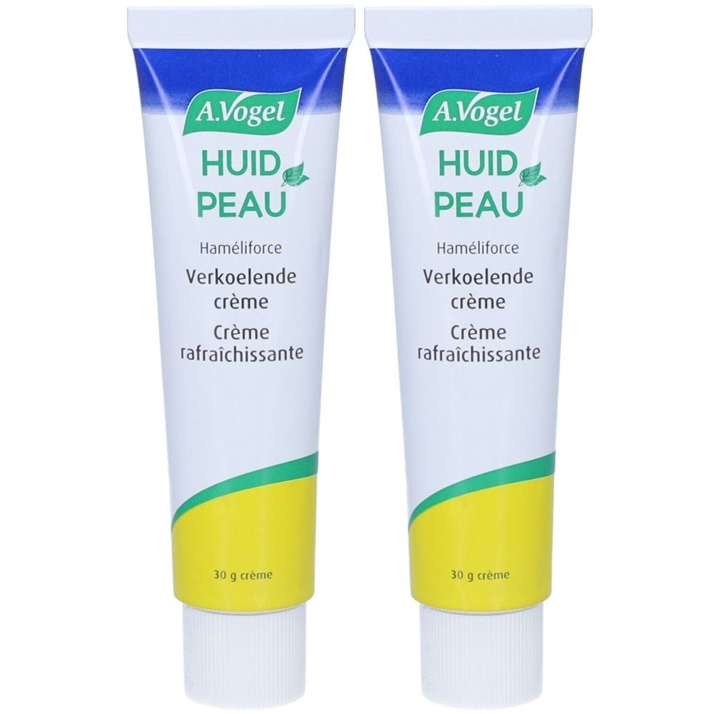 Deux tubes de crème A.Vogel. Blancs, avec bouchon bleu et accents verts. Texte: Huid Peau, Haméliforce, Verkoelende crème, Crème rafraîchissante.