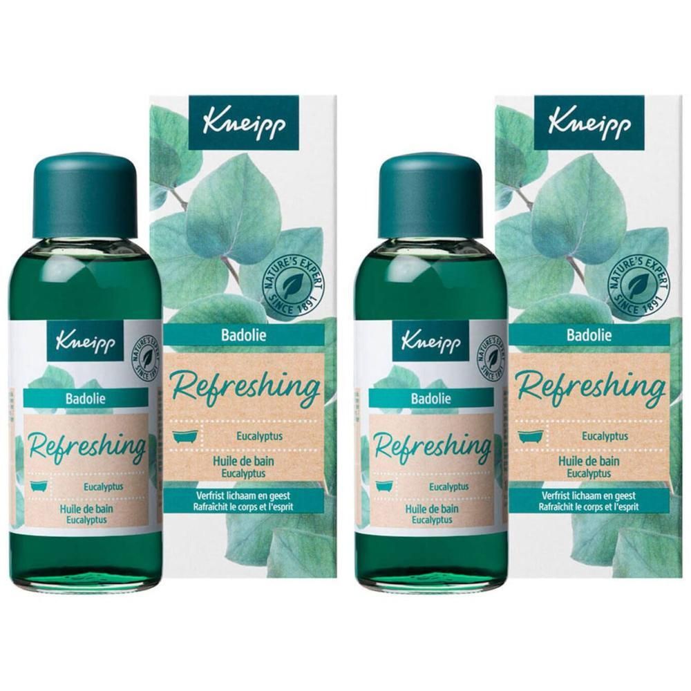 Zwei Flaschen Kneipp Badöl Eucalyptus mit Verpackung. Grüne Flaschen mit blauem Deckel. Aufschrift: Refreshing, Badolie.