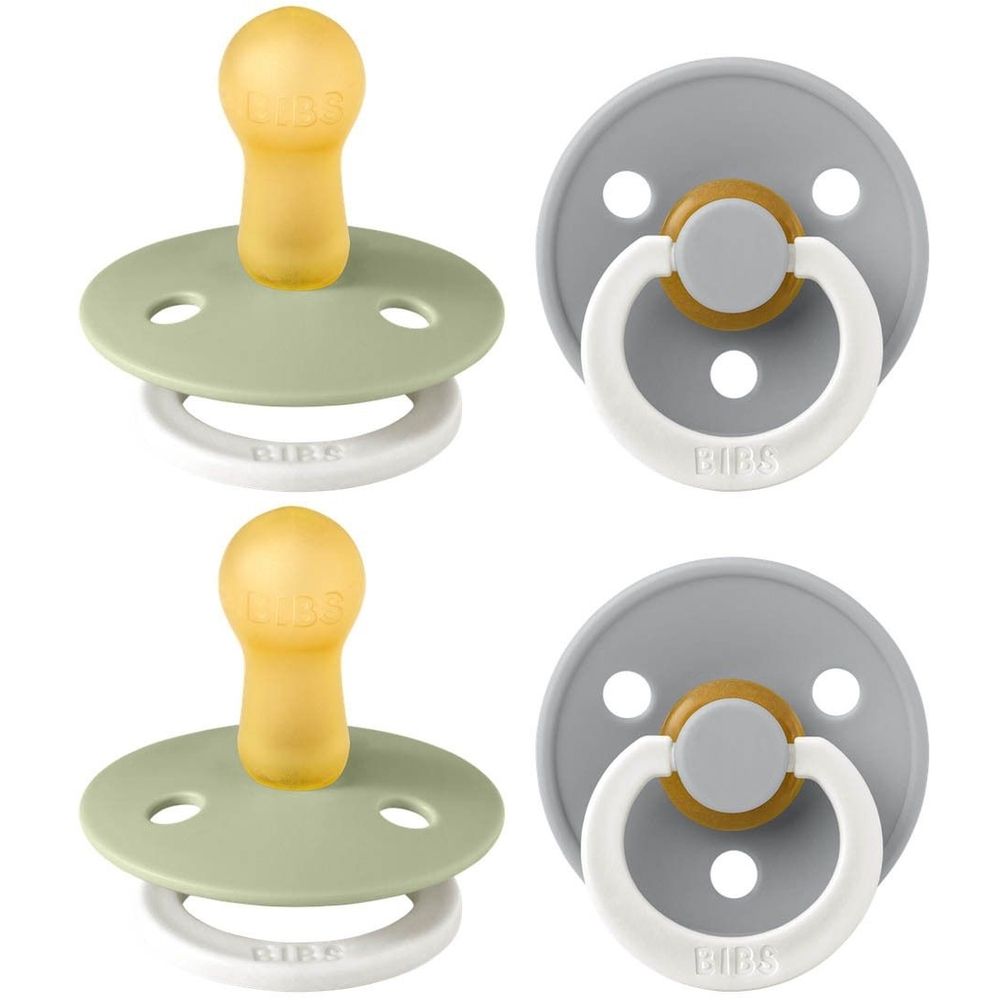 Quatre sucettes BIBS COLOUR. Taille 2, caoutchouc naturel. Vert et gris. Anneaux blancs. Tétines jaunes. Deux paires.