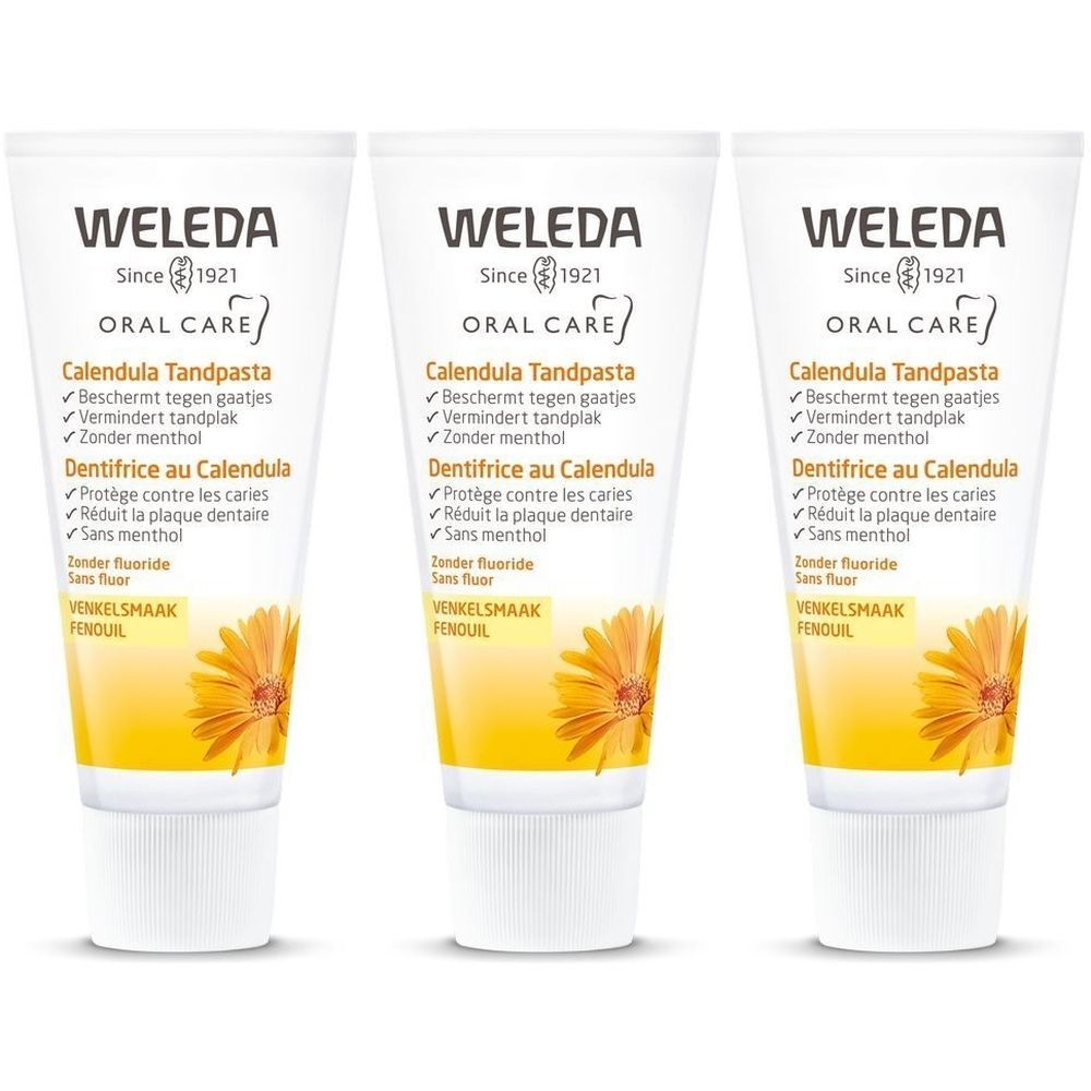 Trois tubes de dentifrice Weleda Calendula. Tubes blancs avec étiquette jaune et informations sur le produit. Visible : marque, nom du produit, ingrédients.