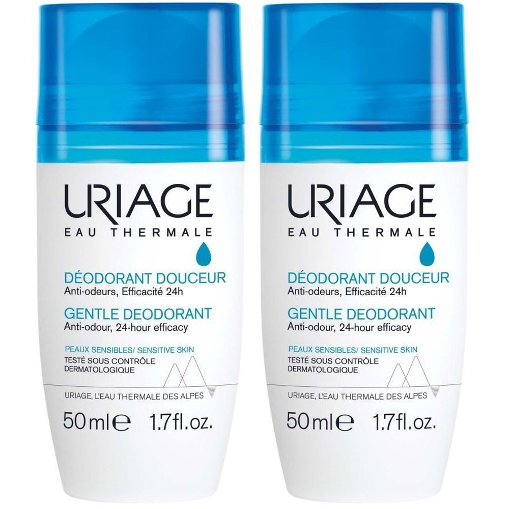 Deux déodorants roll-on blancs avec bouchons bleus. Texte: Uriage, Eau Thermale, Déodorant Douceur, Gentle Deodorant.