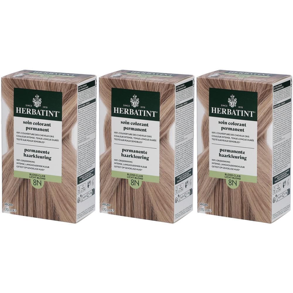 Drei Packungen Herbatint Soin Colorant Permanent 8N Blond Clair. Kartons mit Produktinformationen und Haarfarbenbeispiel.