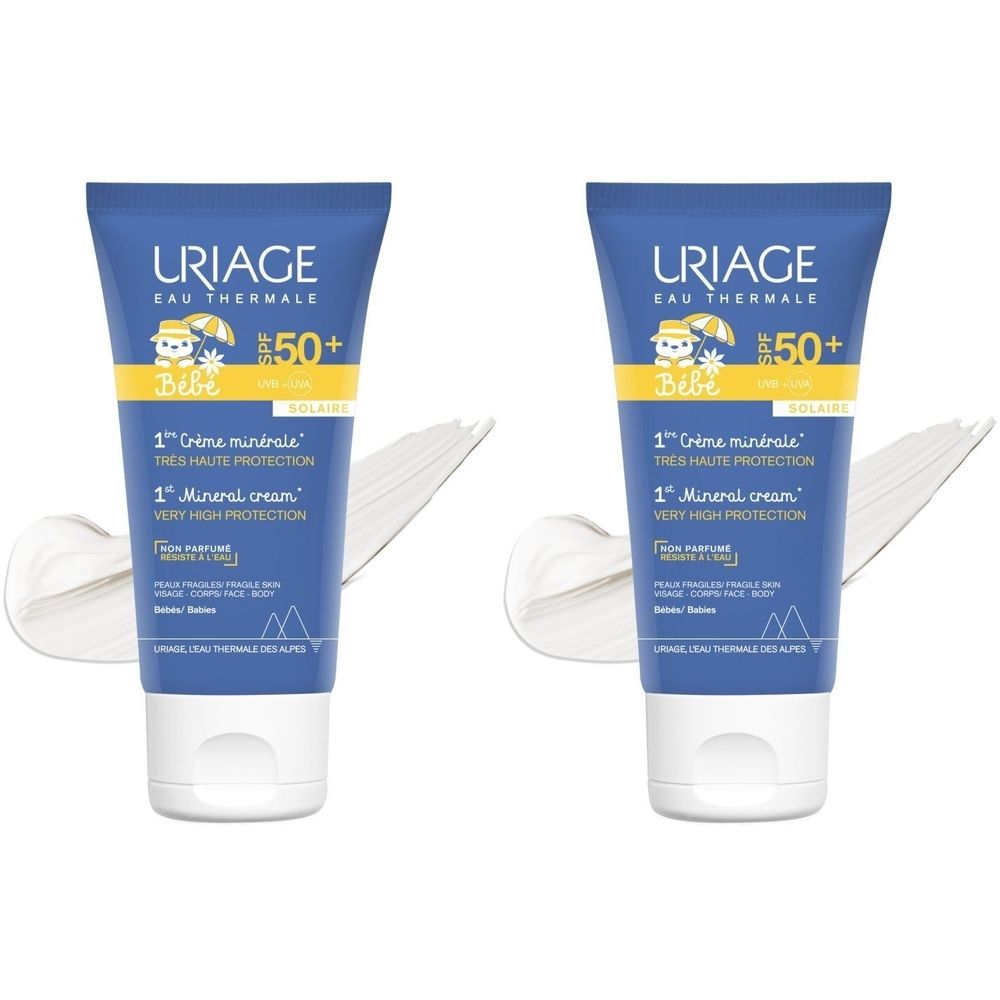 Deux tubes bleus Uriage Bébé SPF50+ avec traces de crème. Texte: 1ère Crème minérale, Très haute protection, 1st Mineral cream.