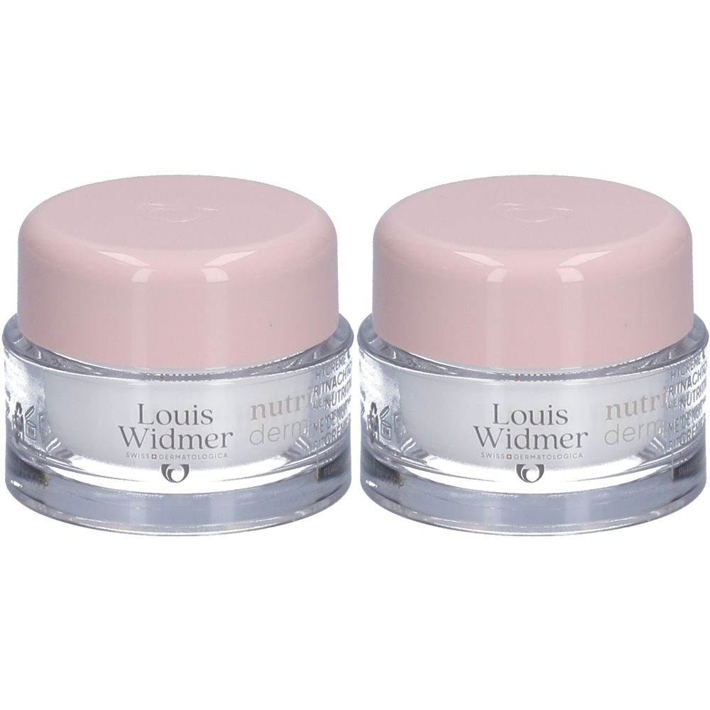 Deux pots de crème de nuit Louis Widmer Nutriderm, couvercles roses, pots transparents.