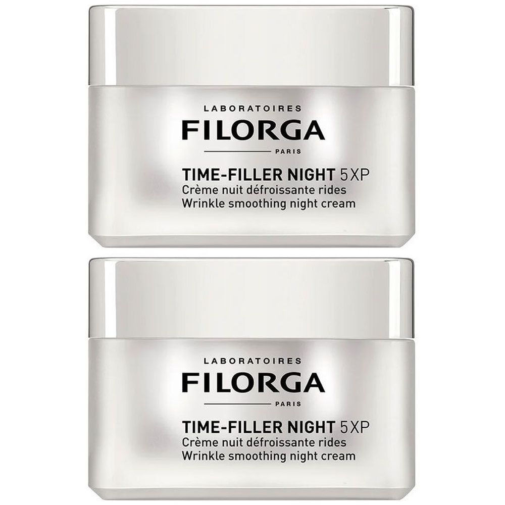 Deux pots de crème de nuit Filorga Time-Filler Night 5XP. Pots blancs avec couvercles argentés et texte noir.