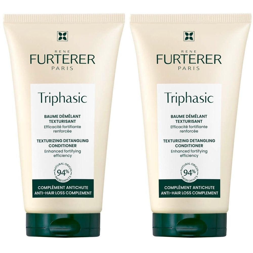 Deux tubes de revitalisant. Corps crème, bouchon vert. Inscription: Triphasic, Texturizing Detangling Conditioner.