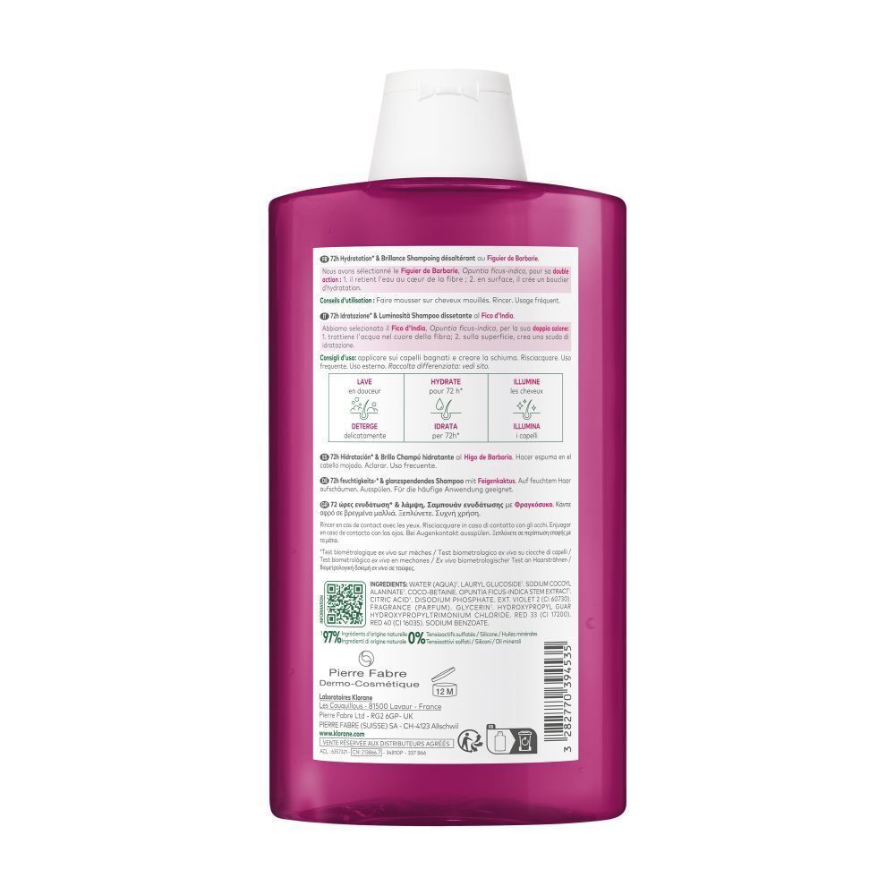Dos d'une bouteille de shampooing Klorane rose. Texte et logos. 97% d'ingrédients d'origine naturelle.