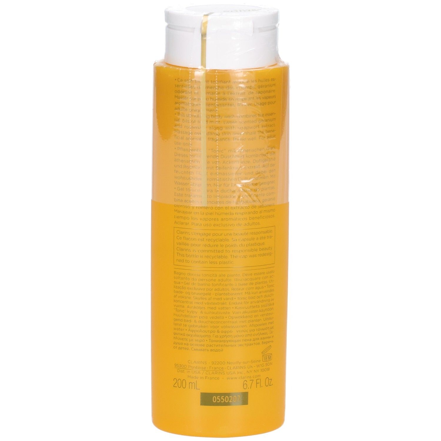 Rückseite einer gelben Clarins Tonic Bad & Duschkonzentrat-Flasche, zeigt 200 ml / 6.7 Fl. Oz.