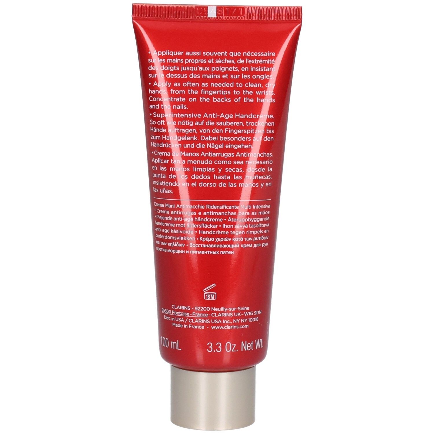 Rückseite einer roten Tube Clarins Handcreme mit detaillierten Anwendungshinweisen und Produktinformationen.