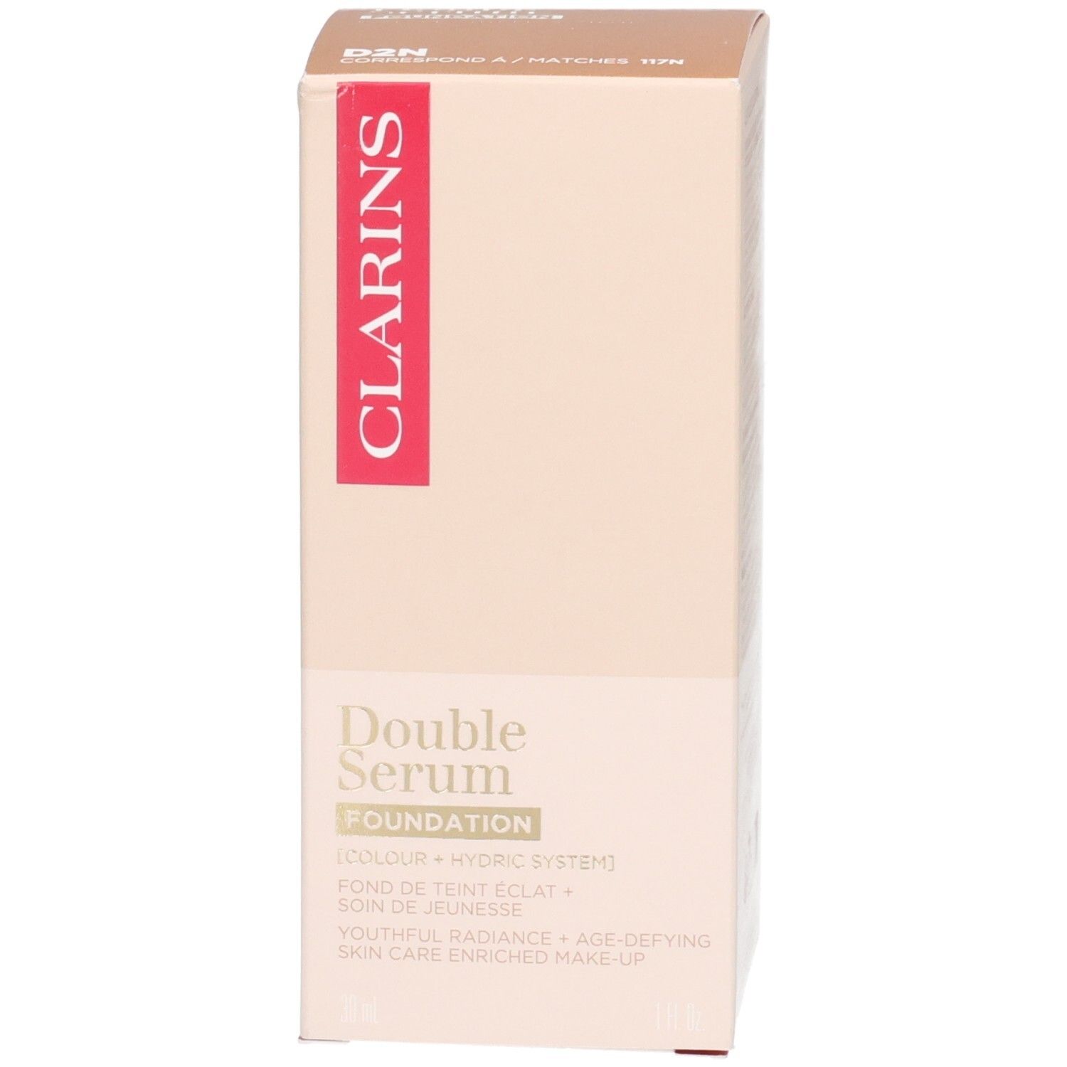 Verpackung von Clarins Double Serum Foundation mit goldfarbenem Pumpspender und braunem Inhalt.