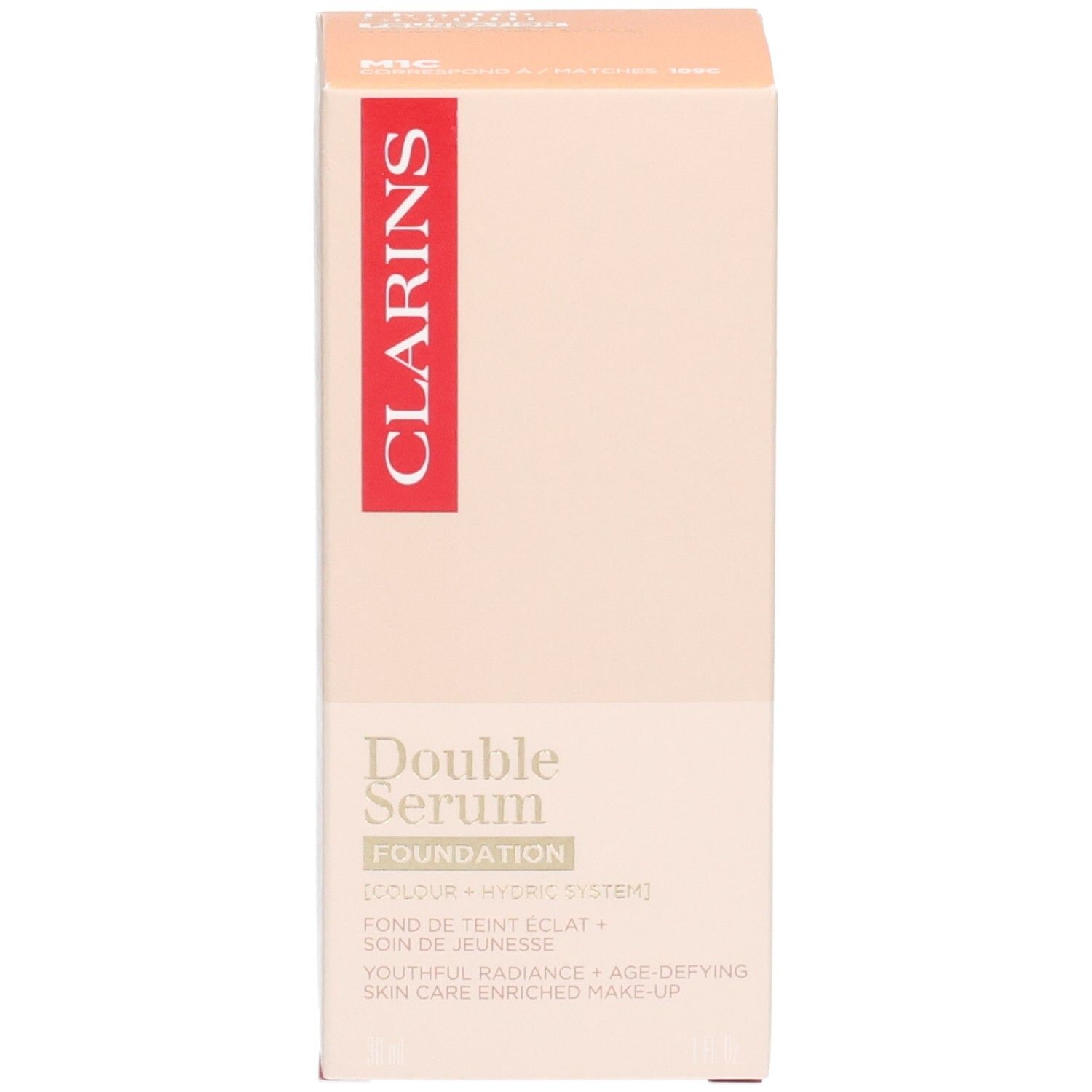 Clarins Double Serum Foundation M1C Karton. Goldene Pumpe, Flasche mit zwei Kammern, Text auf der Vorderseite.