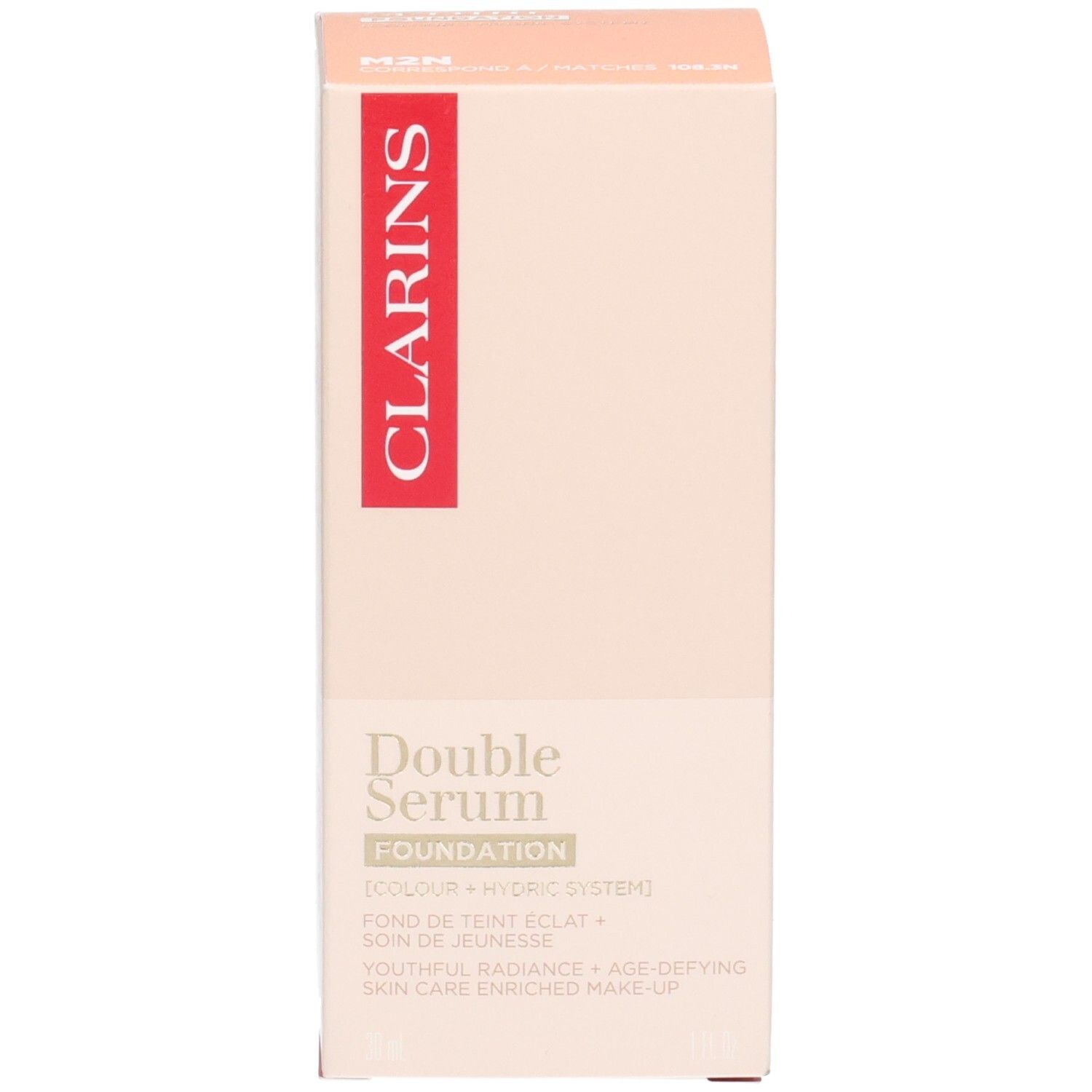 Clarins Double Serum Foundation M2N: Goldfarbener Pumpspender mit beigem Foundation-Inhalt in der unteren Kammer.