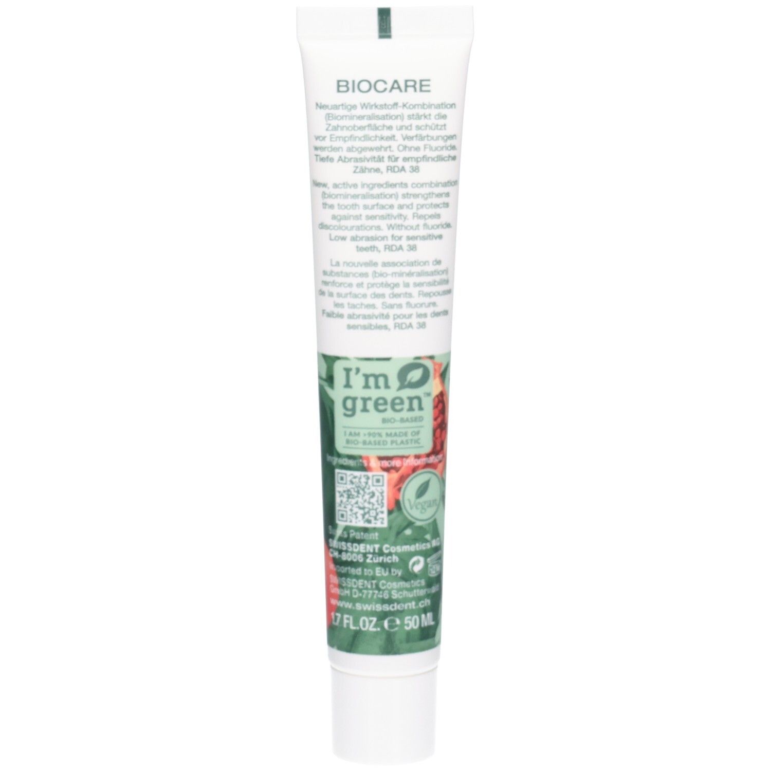 Rückseite der Zahncreme-Tube. Textinformationen, darunter Inhaltsstoffe und Zertifizierungen. Grün-weiße Farbgebung.