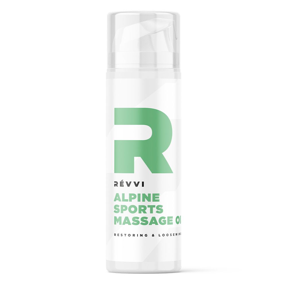 Flacon blanc avec logo et texte verts. Inscription : RÉVVI, ALPINE SPORTS MASSAGE OIL. Bouchon transparent.
