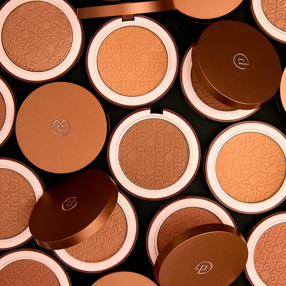 Collistar Magica Bronzing Powder, boîte à côté de l'emballage, avec poudre en relief.