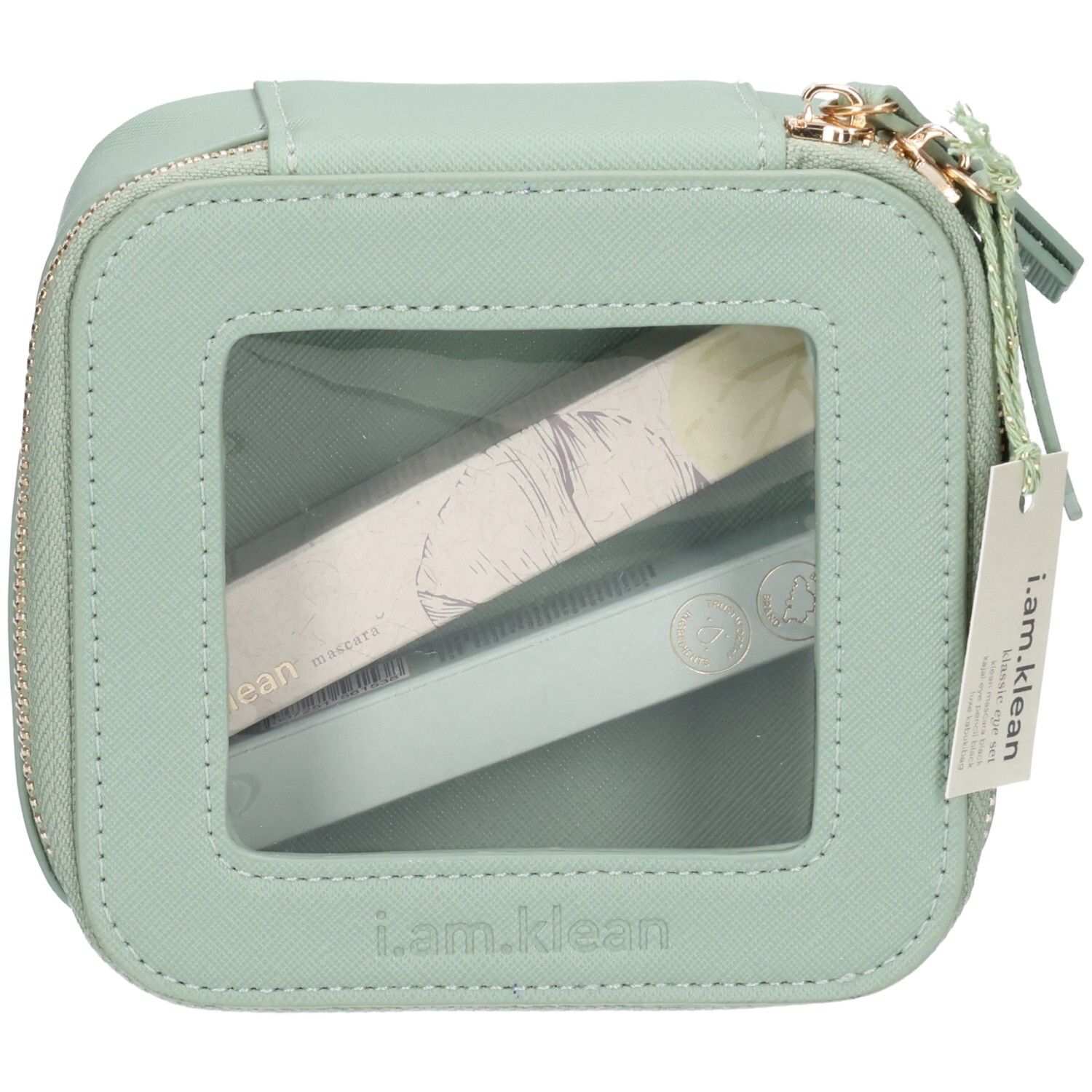 Hellgrüne, quadratische Kosmetiktasche mit Reißverschluss und transparentem Fenster. Enthält zwei längliche, verpackte Produkte. Anhänger mit Logo.