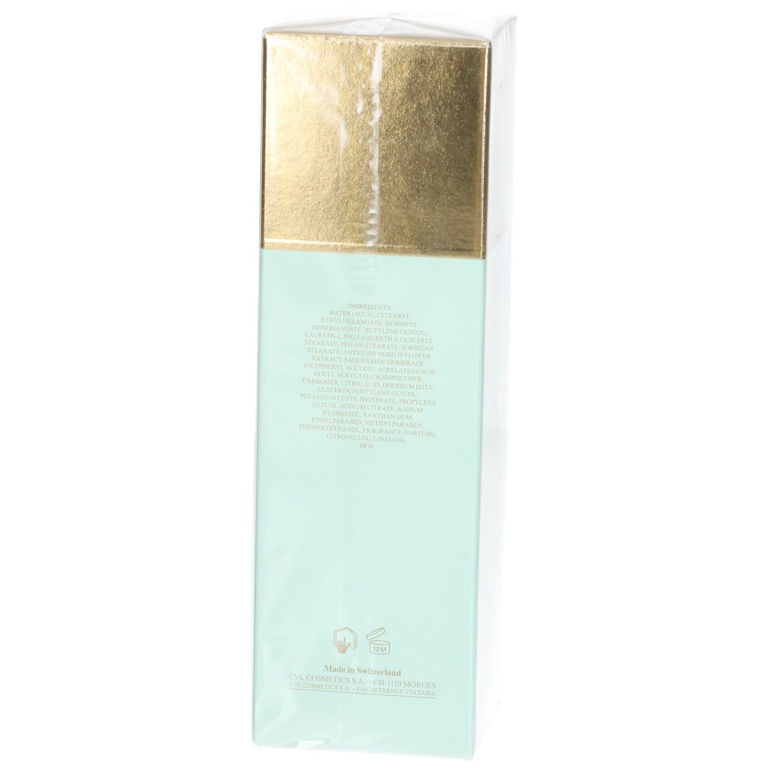 Valmont Fluid Falls Verpackung, mintgrün mit goldener Kappe, Rückseite mit Text.